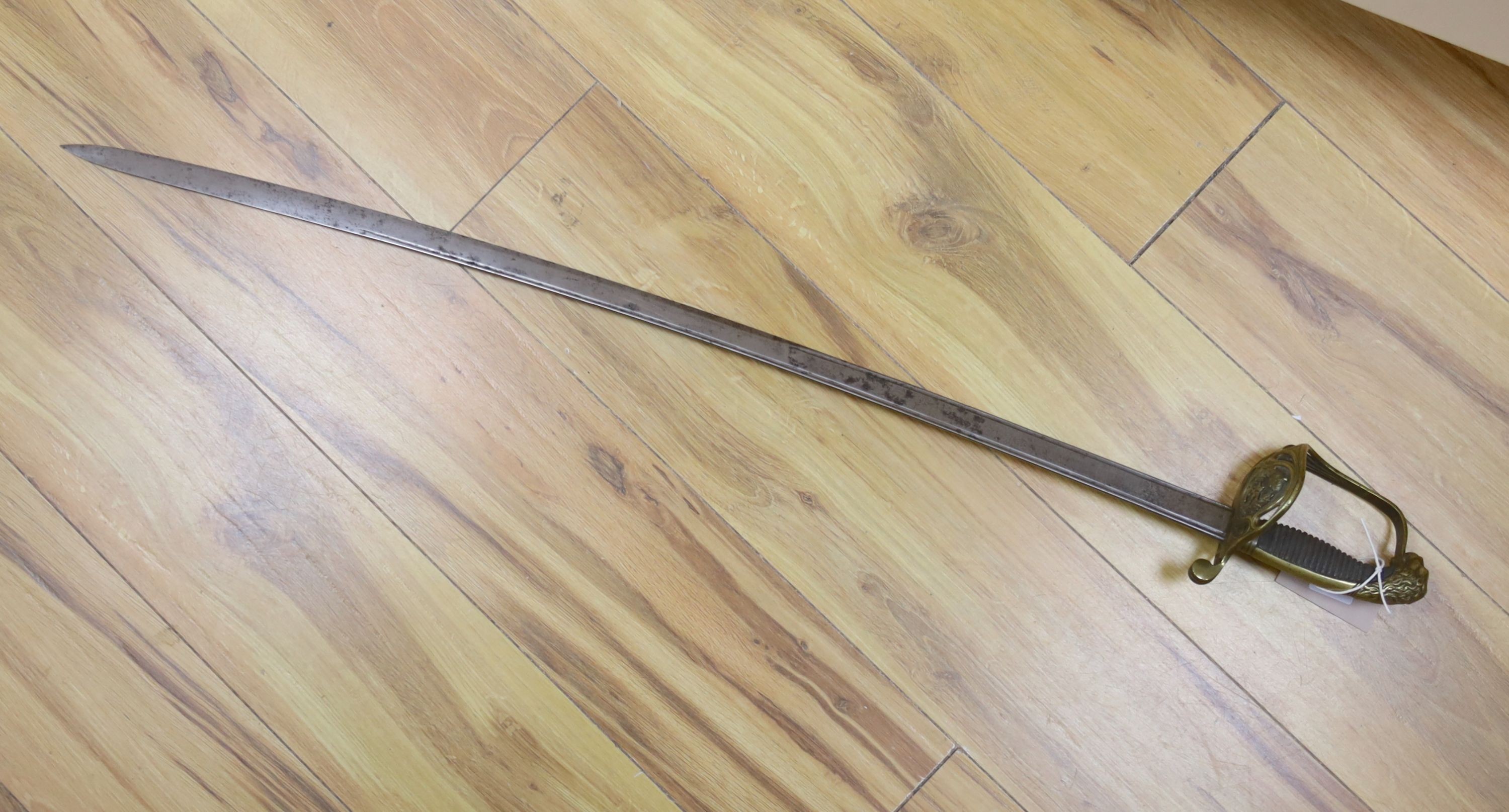 A Spanish officer's sword, dated 1873, the etched blade Fabrica de Toledo, total length 98cm